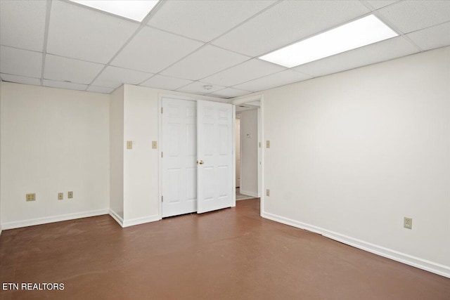 basement featuring a drop ceiling