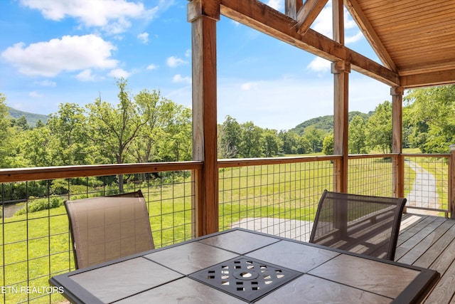 wooden deck with a yard