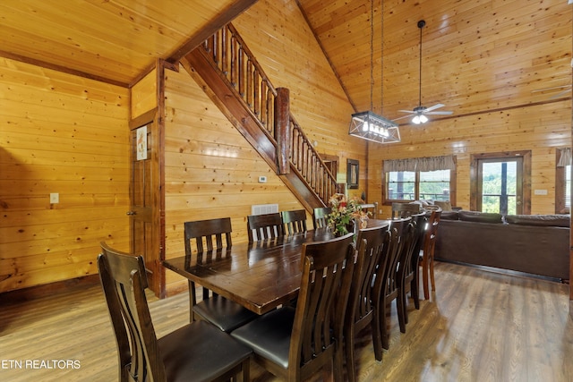 dining area featuring hardwood / wood-style flooring, high vaulted ceiling, ceiling fan, and wood ceiling