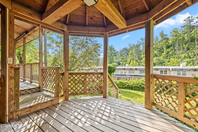 wooden terrace featuring a gazebo