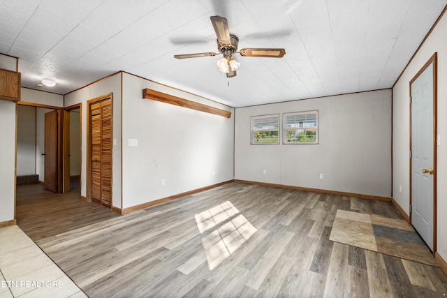 unfurnished bedroom featuring ceiling fan and light hardwood / wood-style flooring