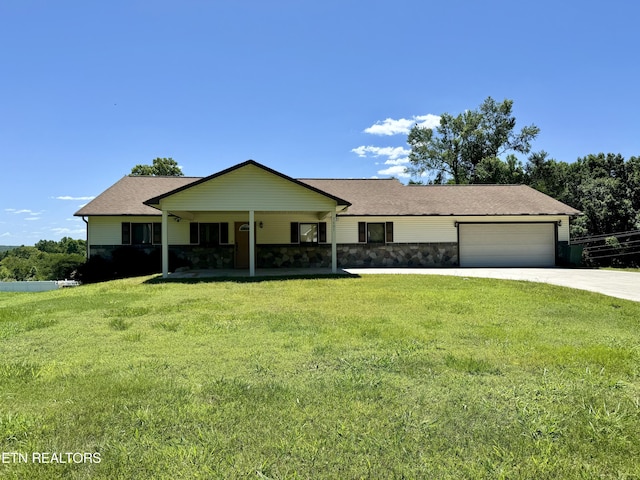 single story home featuring a front lawn and a garage