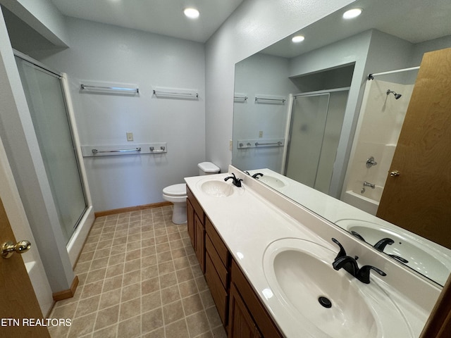 full bathroom featuring vanity, separate shower and tub, and toilet