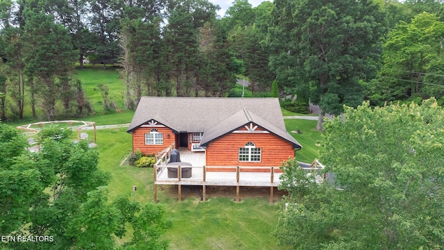 back of house with a deck