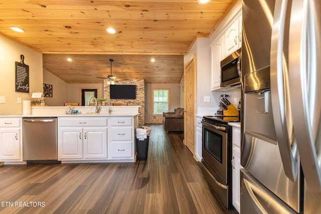 kitchen featuring lofted ceiling, wooden ceiling, white cabinets, dark hardwood / wood-style floors, and stainless steel appliances