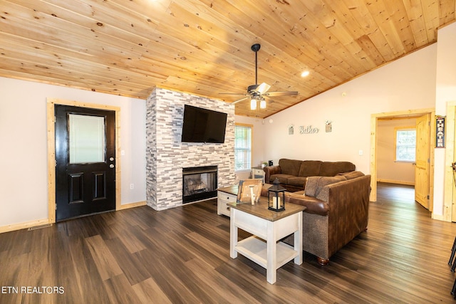 living room with wooden ceiling, vaulted ceiling, dark hardwood / wood-style floors, ceiling fan, and a fireplace