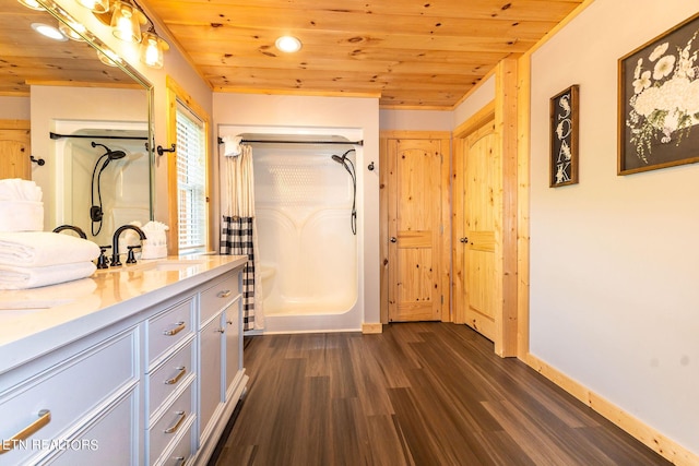 bathroom with a shower, hardwood / wood-style floors, vanity, and wooden ceiling