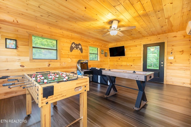 game room with ceiling fan, dark hardwood / wood-style floors, wooden ceiling, and a wealth of natural light