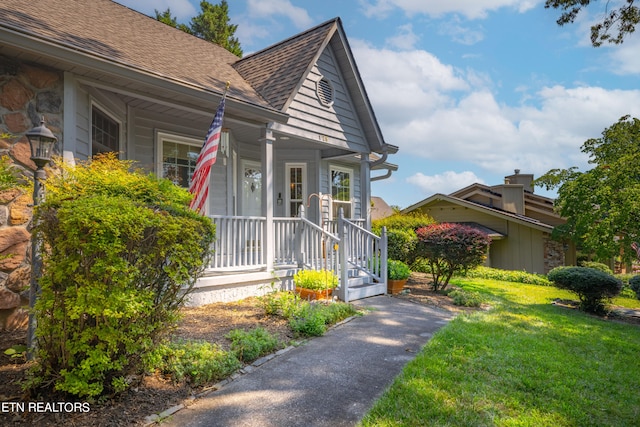 bungalow featuring a front yard and a porch