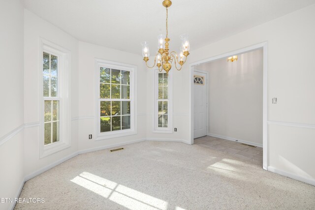 unfurnished dining area featuring light carpet and a notable chandelier