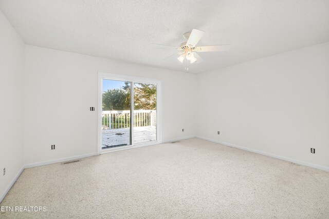 spare room featuring ceiling fan and a textured ceiling