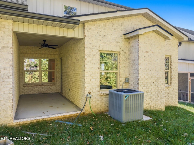 view of side of home with cooling unit, a patio area, and ceiling fan