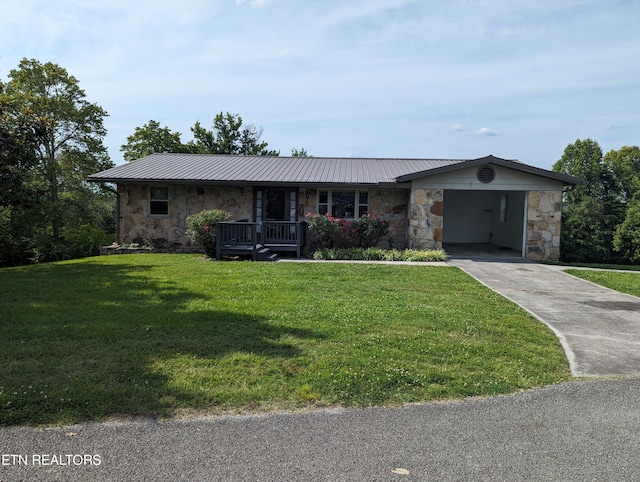 ranch-style home featuring a front lawn, a carport, and a porch