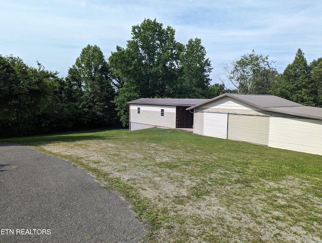 garage featuring a yard