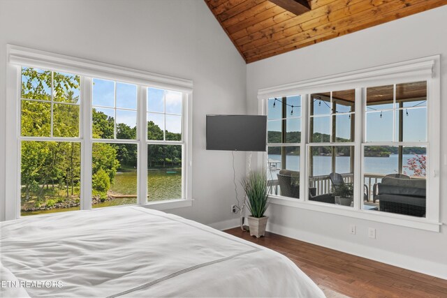 bedroom with hardwood / wood-style floors, vaulted ceiling, multiple windows, and wood ceiling