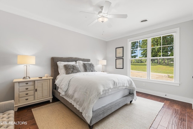 bedroom featuring ceiling fan and dark hardwood / wood-style floors