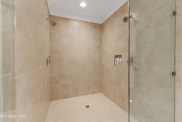 bathroom with a tile shower