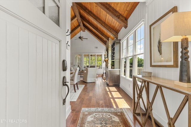 hallway featuring beam ceiling, dark hardwood / wood-style flooring, wooden ceiling, and high vaulted ceiling