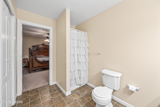 bathroom featuring toilet and ceiling fan