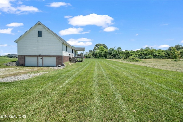 view of yard with a garage