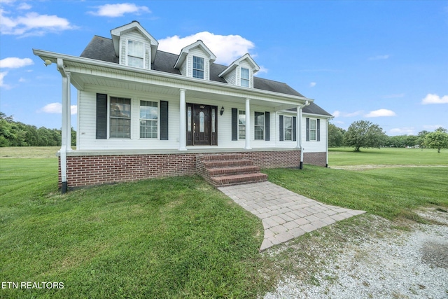 view of front of house featuring covered porch and a front lawn