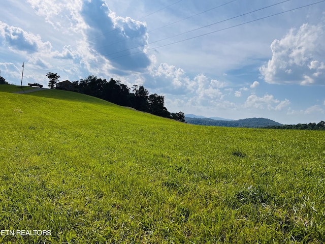 exterior space with a mountain view and a rural view