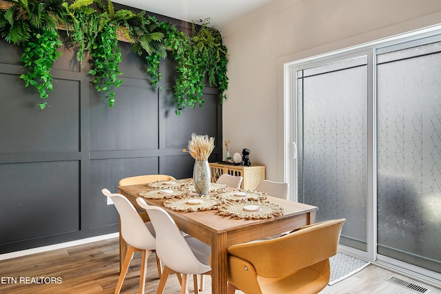 dining room with hardwood / wood-style floors