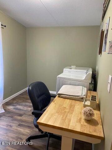 office space with washer and clothes dryer and dark hardwood / wood-style floors