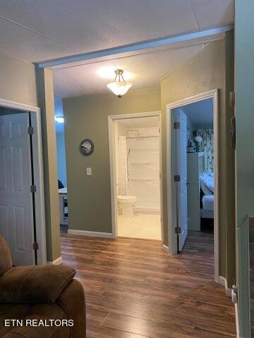 hall with dark hardwood / wood-style flooring