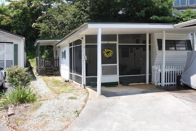 exterior space featuring a carport