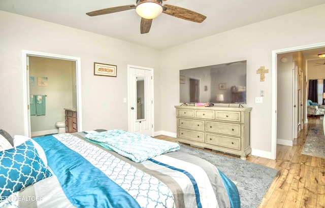 bedroom with ceiling fan, a closet, connected bathroom, and light hardwood / wood-style flooring