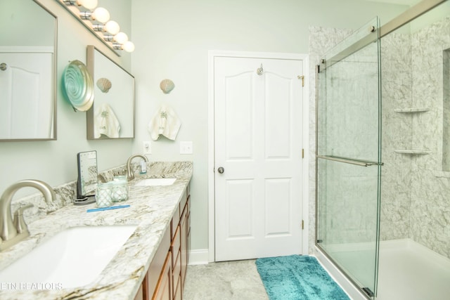 bathroom with a shower with door and vanity