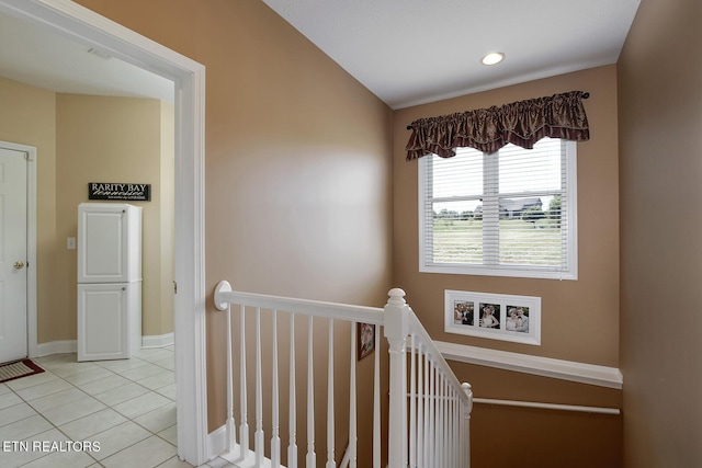 hallway featuring light tile patterned floors