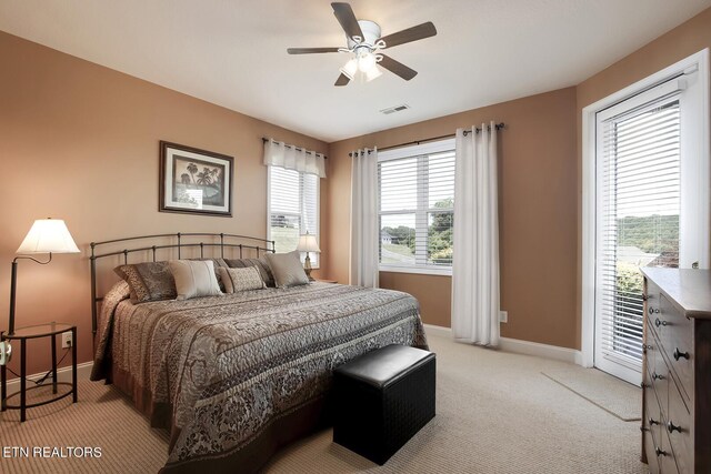 carpeted bedroom with access to exterior and ceiling fan