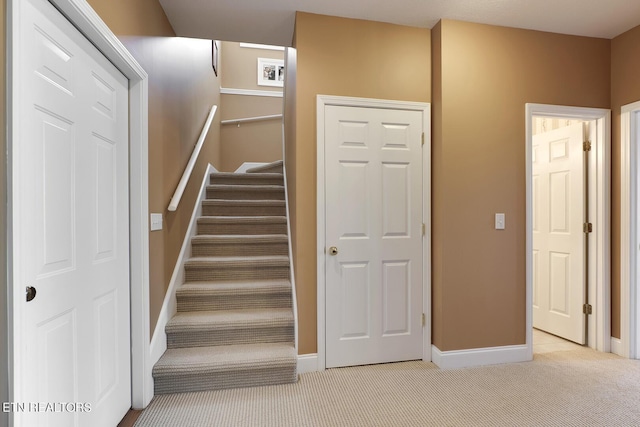 stairway with carpet flooring