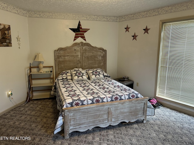 carpeted bedroom with a textured ceiling