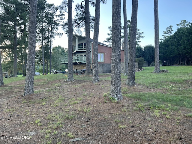 view of yard with a wooden deck