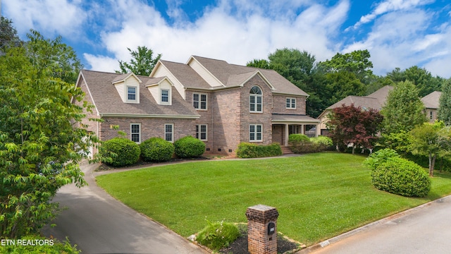 view of front of home with a front yard