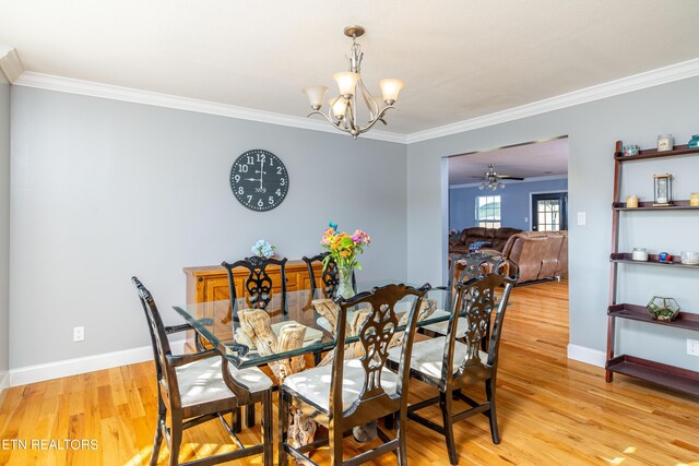 dining room with crown molding, ceiling fan with notable chandelier, and light hardwood / wood-style floors