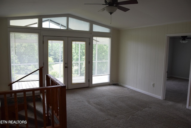 doorway with a wealth of natural light, french doors, carpet, and ceiling fan