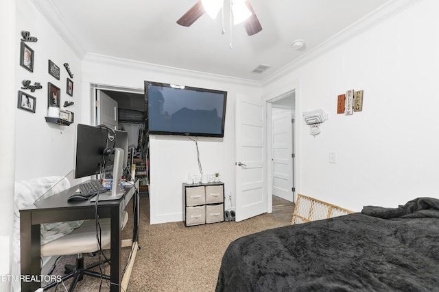 bedroom with carpet floors, ceiling fan, and crown molding