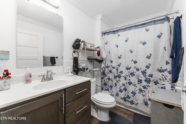 bathroom featuring a shower with shower curtain, ornamental molding, vanity, hardwood / wood-style floors, and toilet