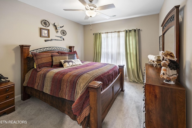 bedroom with ceiling fan and light colored carpet