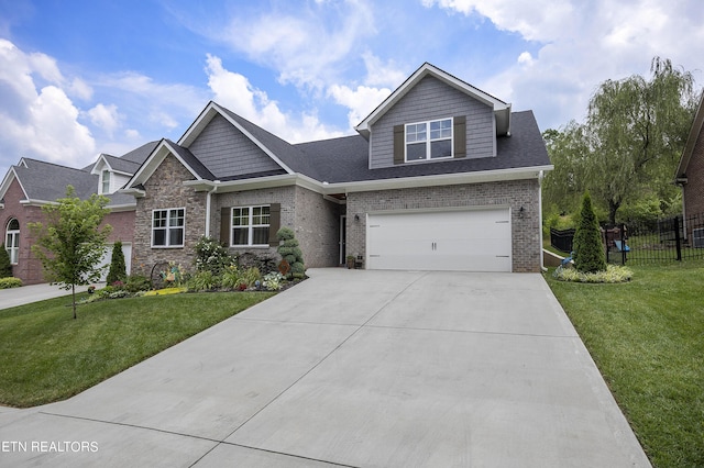 view of front facade with a garage and a front yard