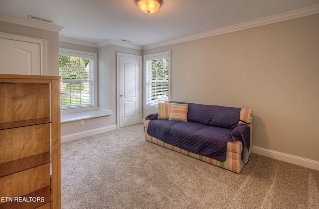 sitting room featuring crown molding, carpet, and a wealth of natural light