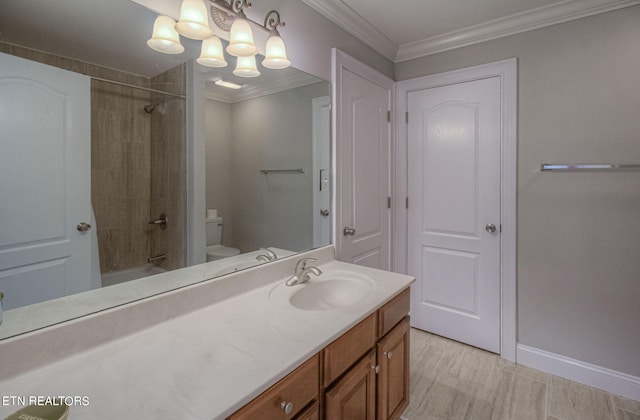 full bathroom featuring toilet, ornamental molding, vanity, tiled shower / bath combo, and hardwood / wood-style flooring