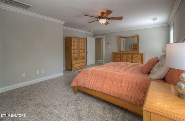 carpeted bedroom featuring crown molding and ceiling fan