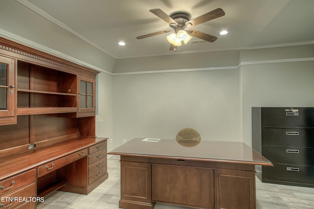 office space with crown molding, built in desk, ceiling fan, and light wood-type flooring