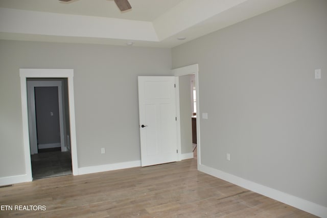 spare room featuring ceiling fan and light wood-type flooring