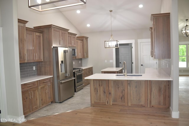 kitchen featuring appliances with stainless steel finishes, backsplash, light hardwood / wood-style flooring, and lofted ceiling